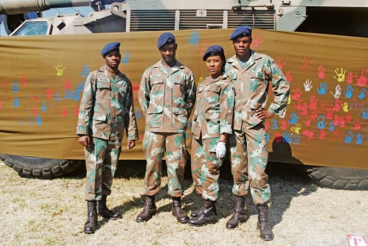 Gunners on hand-painting duty.